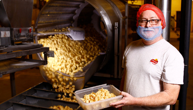 A worker with a mask staring to the camera